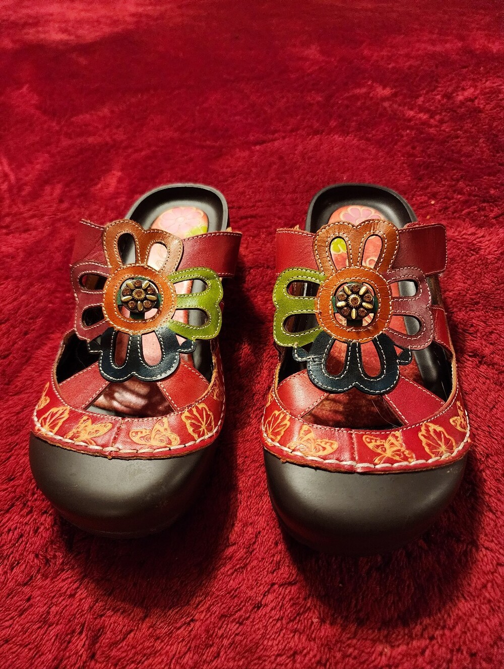 Elite by Conrys Red leather sandals with floral appliqués and gold stitching,